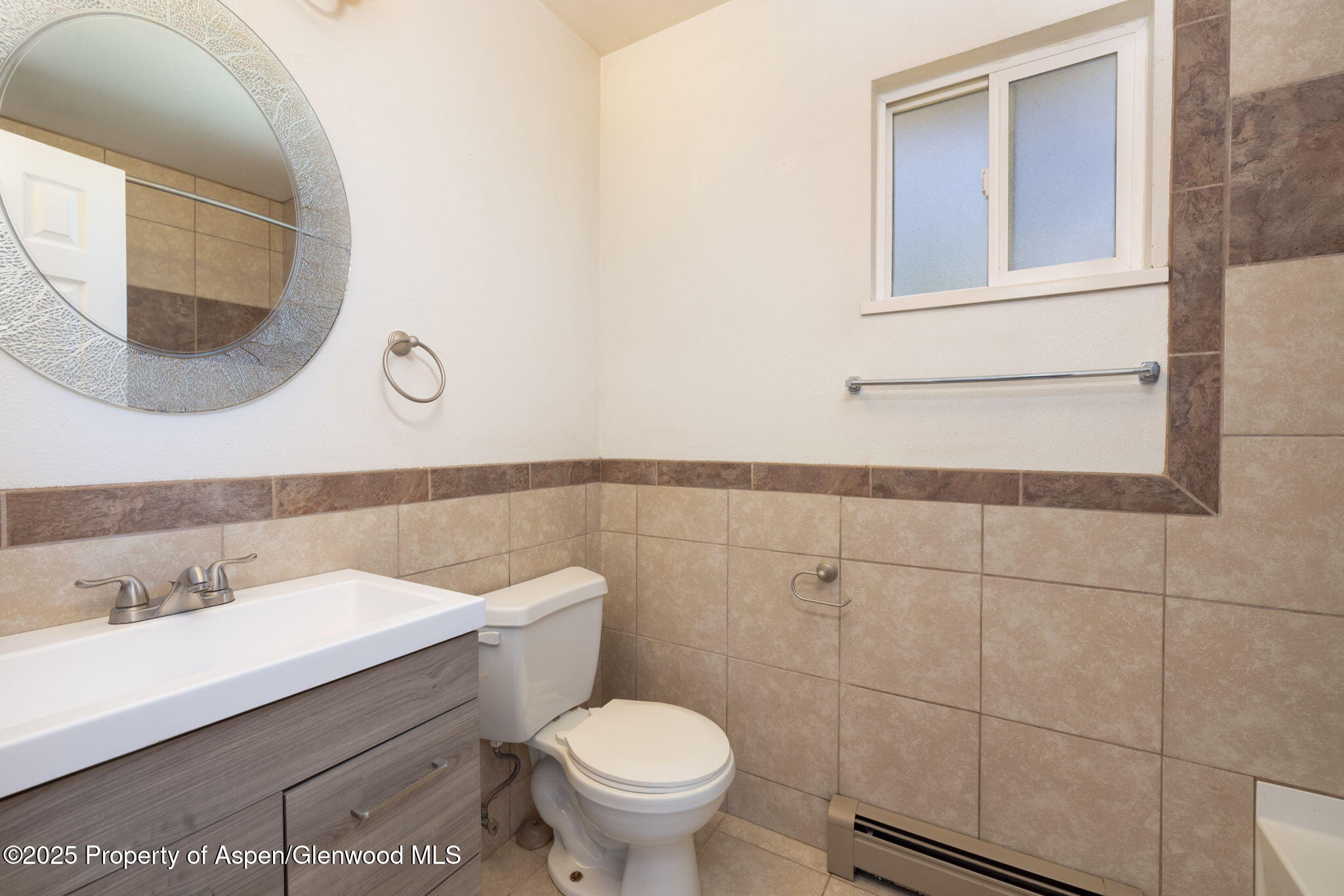 482 Fox Run Clifton, CO 81520 - Photo 8 of 25 a bathroom with a sink mirror and toilet