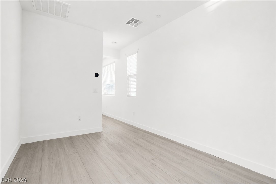 9398 Noble Fir Rdg Court Las Vegas, NV 89143 - Photo 23 of 36 Clean lines and a luminous floor highlight this adaptable interior space.