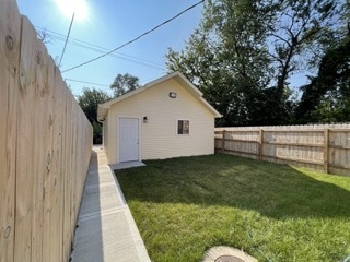 9042 South Lowe Avenue Chicago, IL 60620 - Photo 13 of 16 a view of a backyard with plants and trees