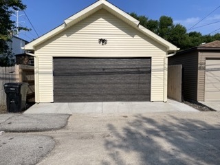9042 South Lowe Avenue Chicago, IL 60620 - Photo 15 of 16 a view of house with yard and garage