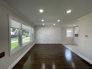 9042 South Lowe Avenue Chicago, IL 60620 - Photo 2 of 16 an empty room with wooden floor and windows