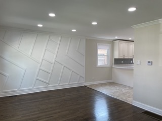 9042 South Lowe Avenue Chicago, IL 60620 - Photo 3 of 16 a view of an empty room with wooden floor and a window