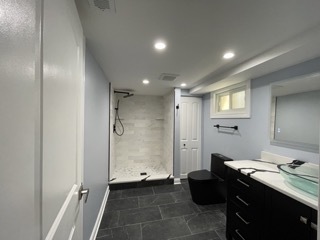 9042 South Lowe Avenue Chicago, IL 60620 - Photo 10 of 16 a bathroom with a sink and a mirror