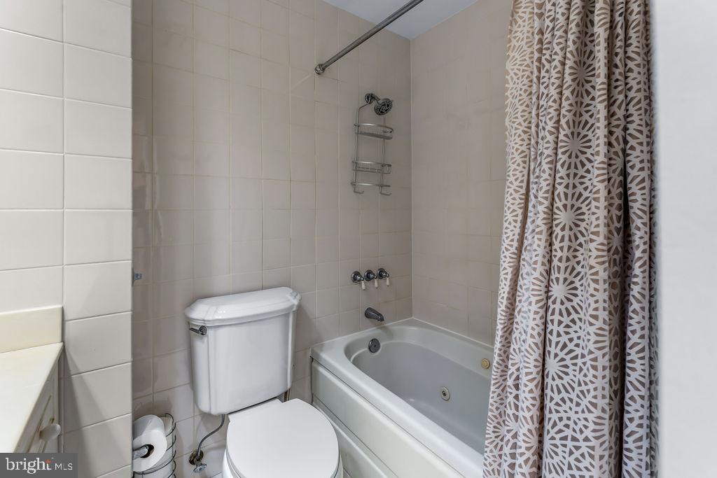 1329 Gresham Road Silver Spring, MD 20904 - Photo 16 of 56 a white toilet sitting next to a bath tub