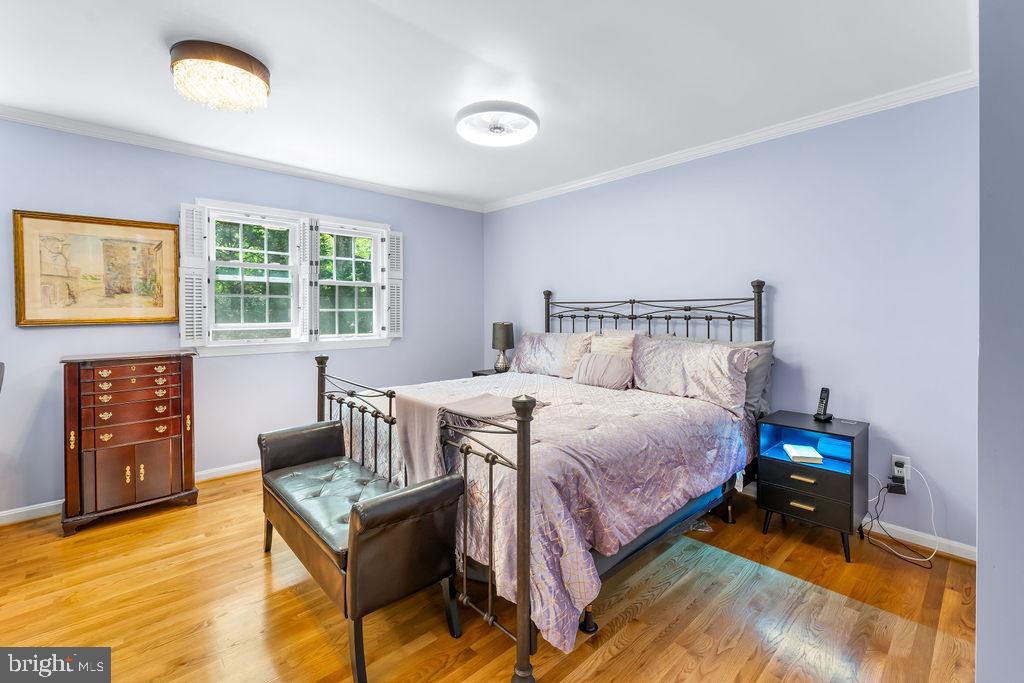 1329 Gresham Road Silver Spring, MD 20904 - Photo 27 of 56 a bedroom with a bed and wooden floor