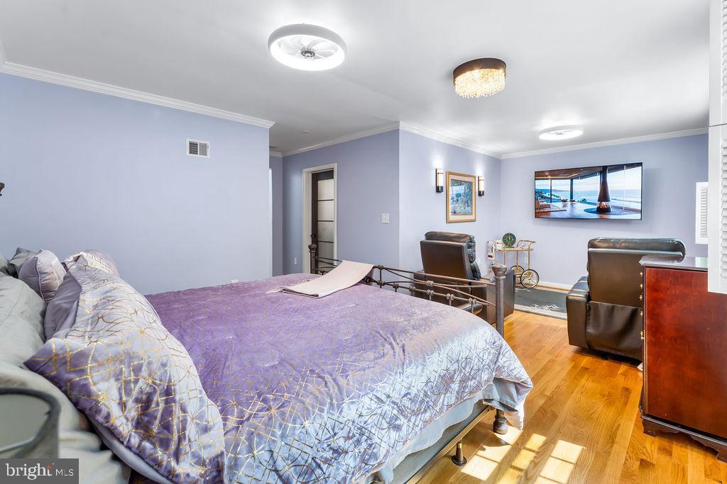 1329 Gresham Road Silver Spring, MD 20904 - Photo 28 of 56 a bedroom with a bed and wooden floor