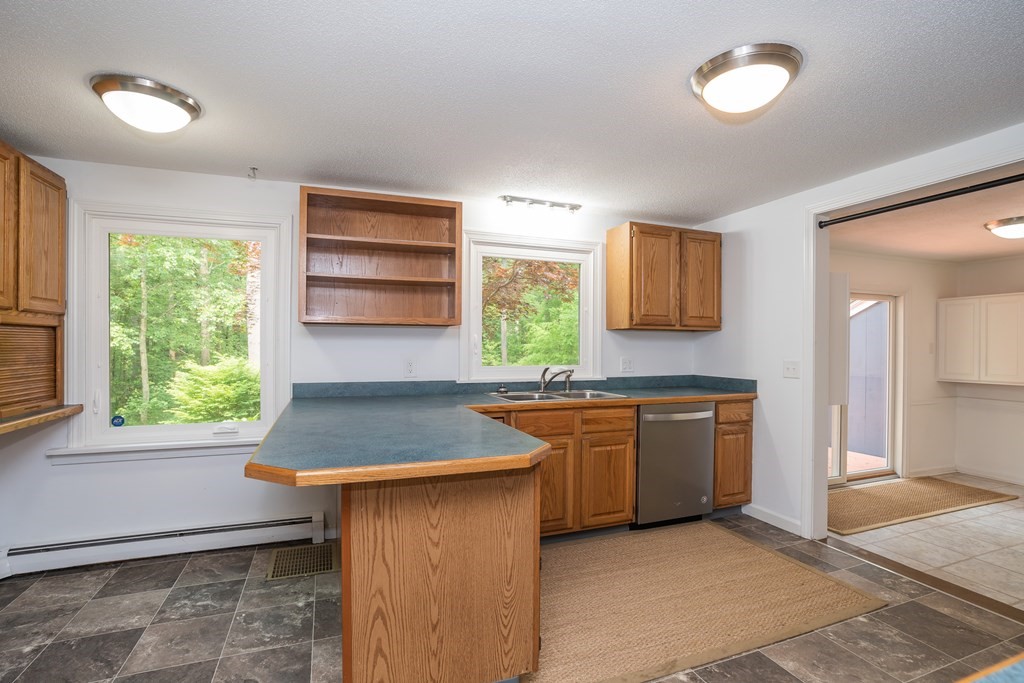 80 Goodell Street Belchertown, MA 01007 - Photo 15 of 40 a kitchen with granite countertop a stove a sink and a refrigerator