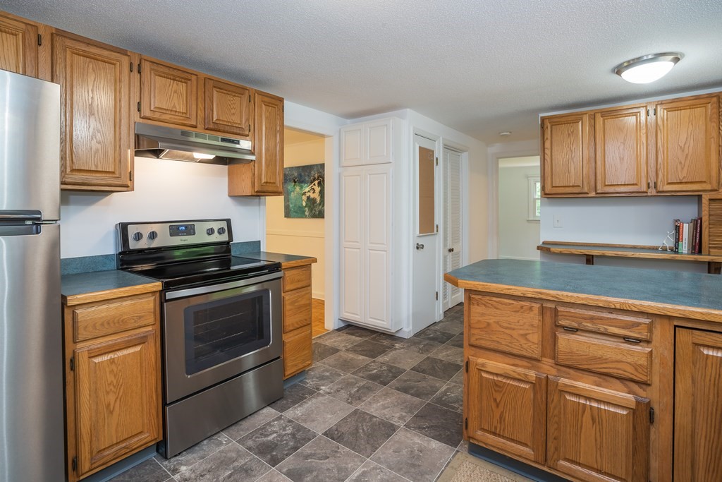 80 Goodell Street Belchertown, MA 01007 - Photo 16 of 40 a kitchen with cabinets and appliances