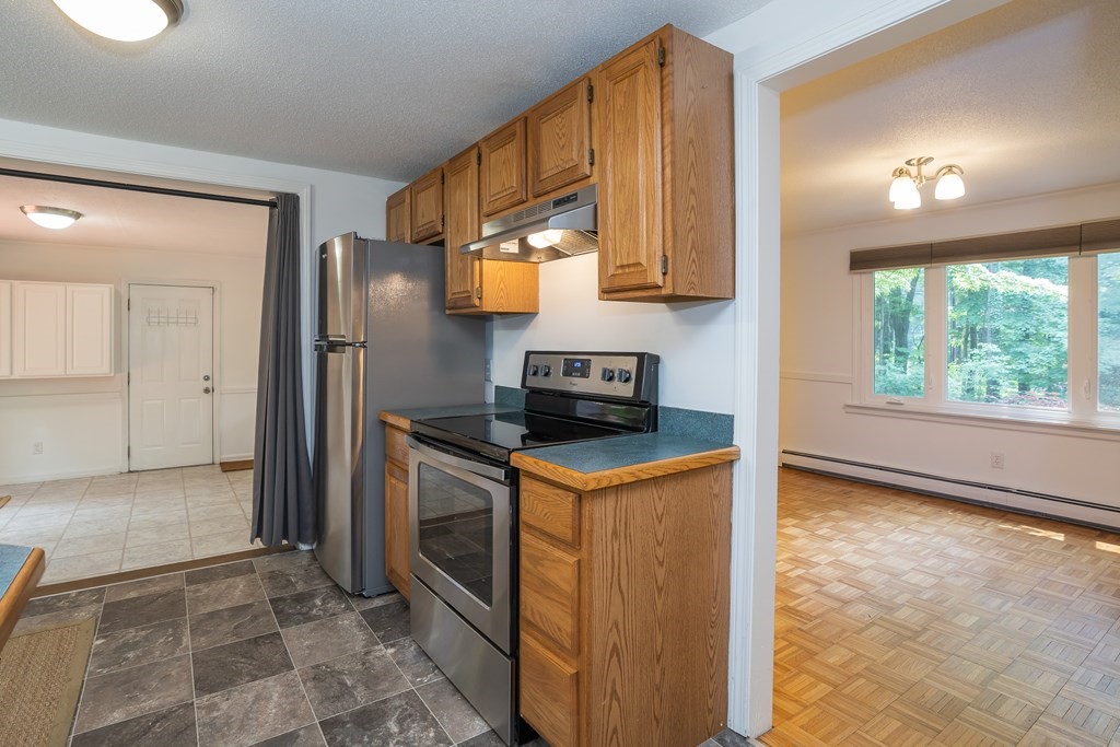 80 Goodell Street Belchertown, MA 01007 - Photo 18 of 40 a kitchen that has a sink a stove and a refrigerator