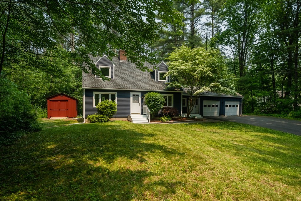 80 Goodell Street Belchertown, MA 01007 - Photo 2 of 40 a front view of a house with a garden