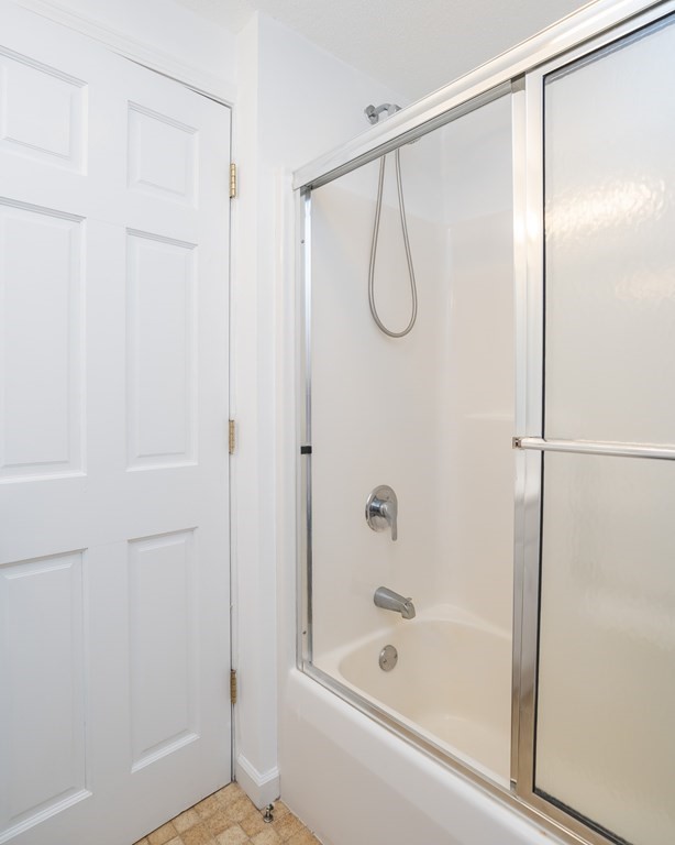 80 Goodell Street Belchertown, MA 01007 - Photo 26 of 40 a bathroom with a glass shower and a glass door