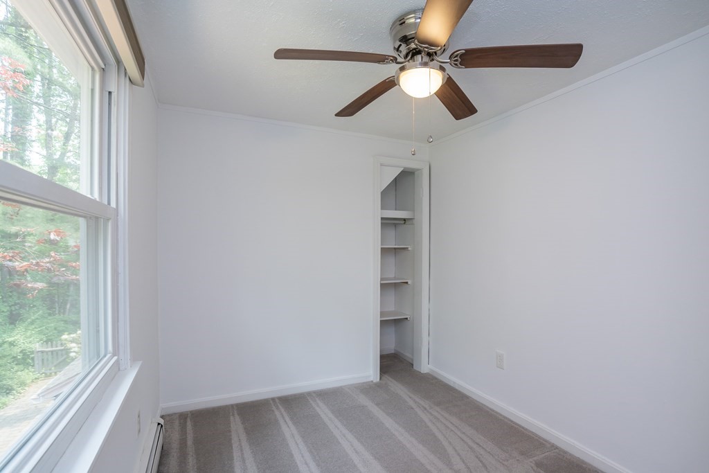 80 Goodell Street Belchertown, MA 01007 - Photo 33 of 40 an empty room with windows and fan