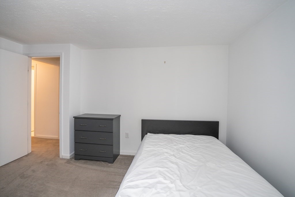 80 Goodell Street Belchertown, MA 01007 - Photo 37 of 40 a bedroom with a bed and a window