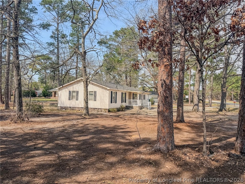 575 Veterans Road St. Pauls, NC 28384 - Photo 21 of 27 a front view of a house with a yard