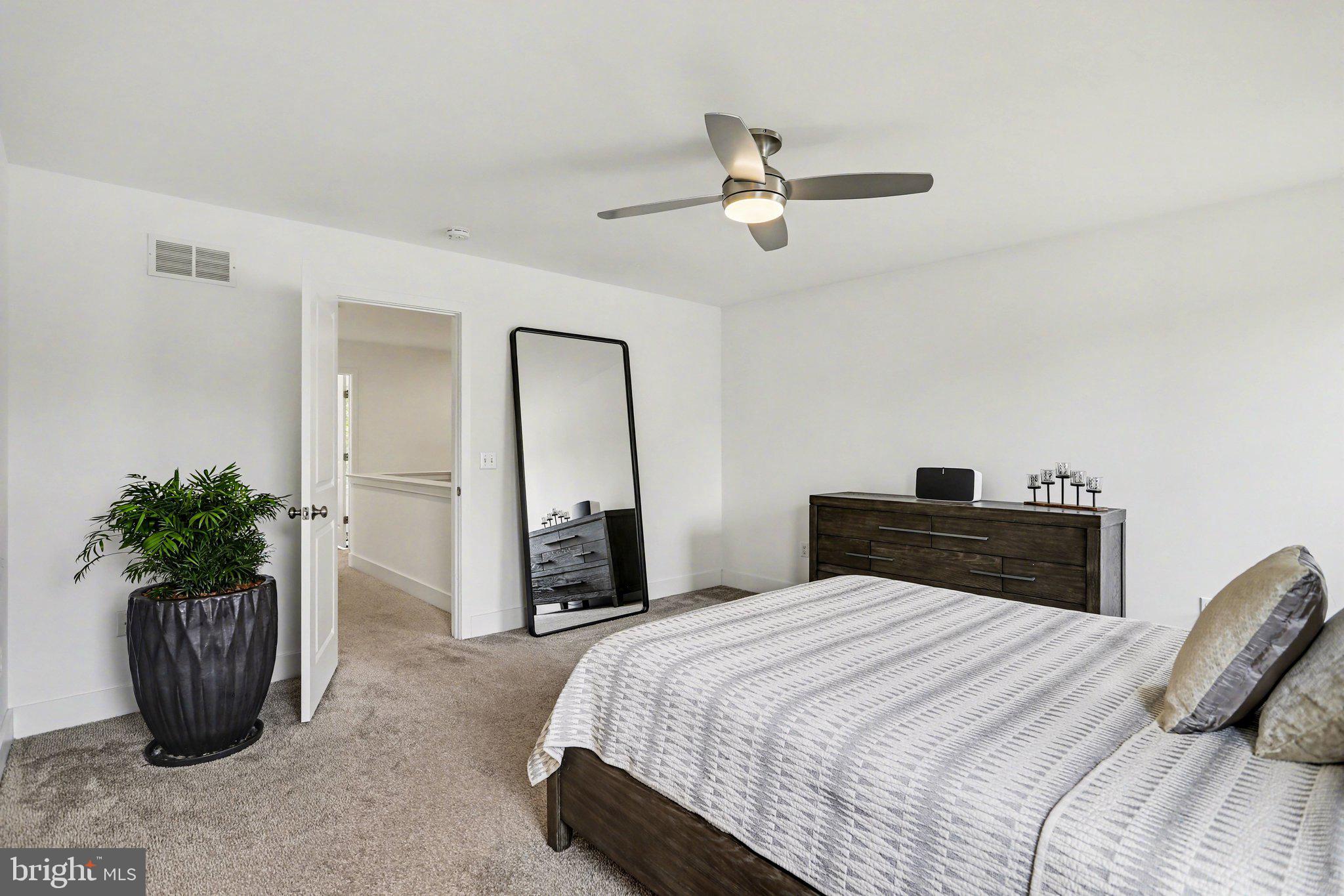 401 Wendover Way Lancaster, PA 17603 - Photo 21 of 45 a bedroom with a bed and potted plant