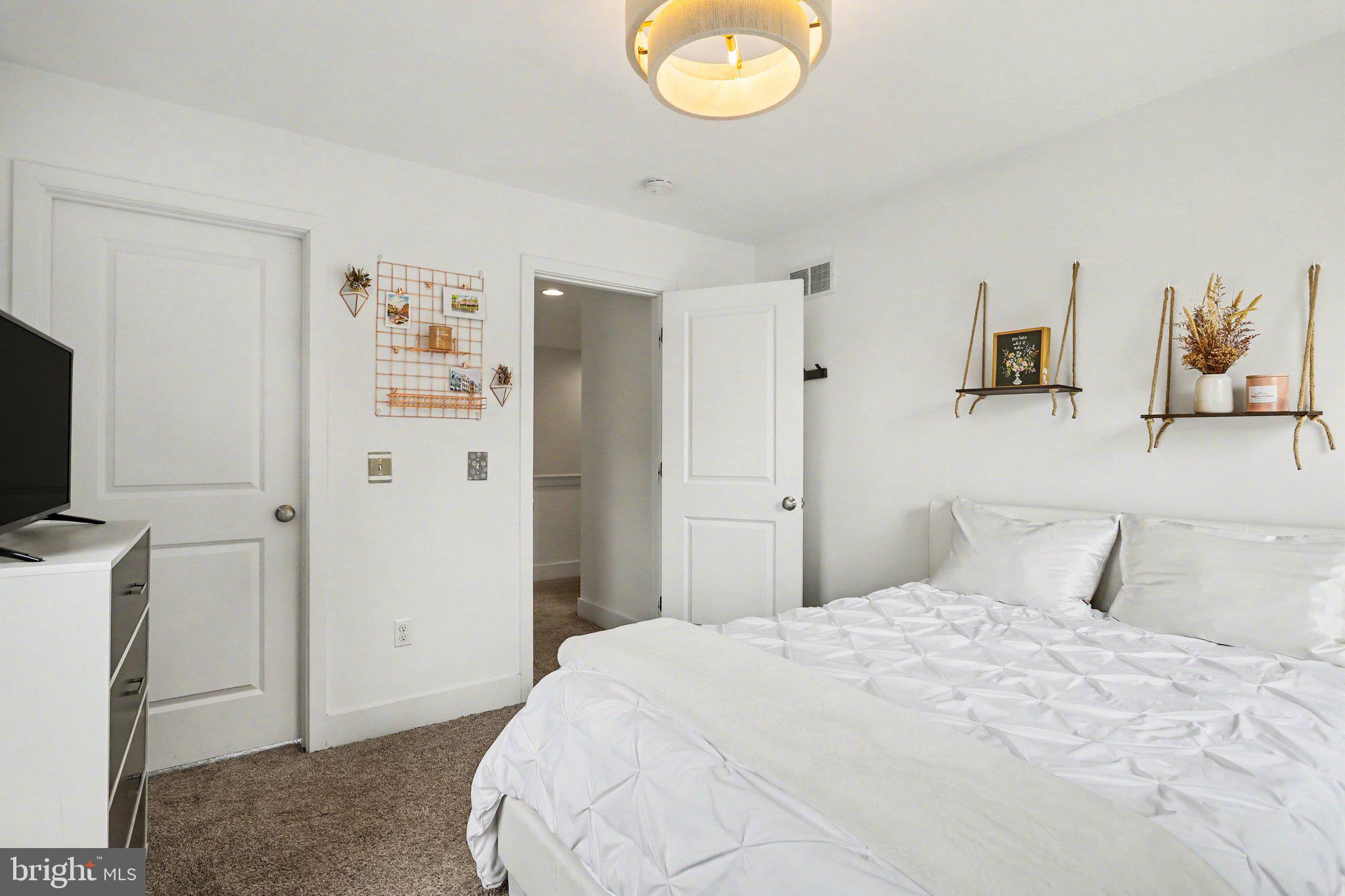 401 Wendover Way Lancaster, PA 17603 - Photo 26 of 45 a bedroom with a bed and a flat screen tv