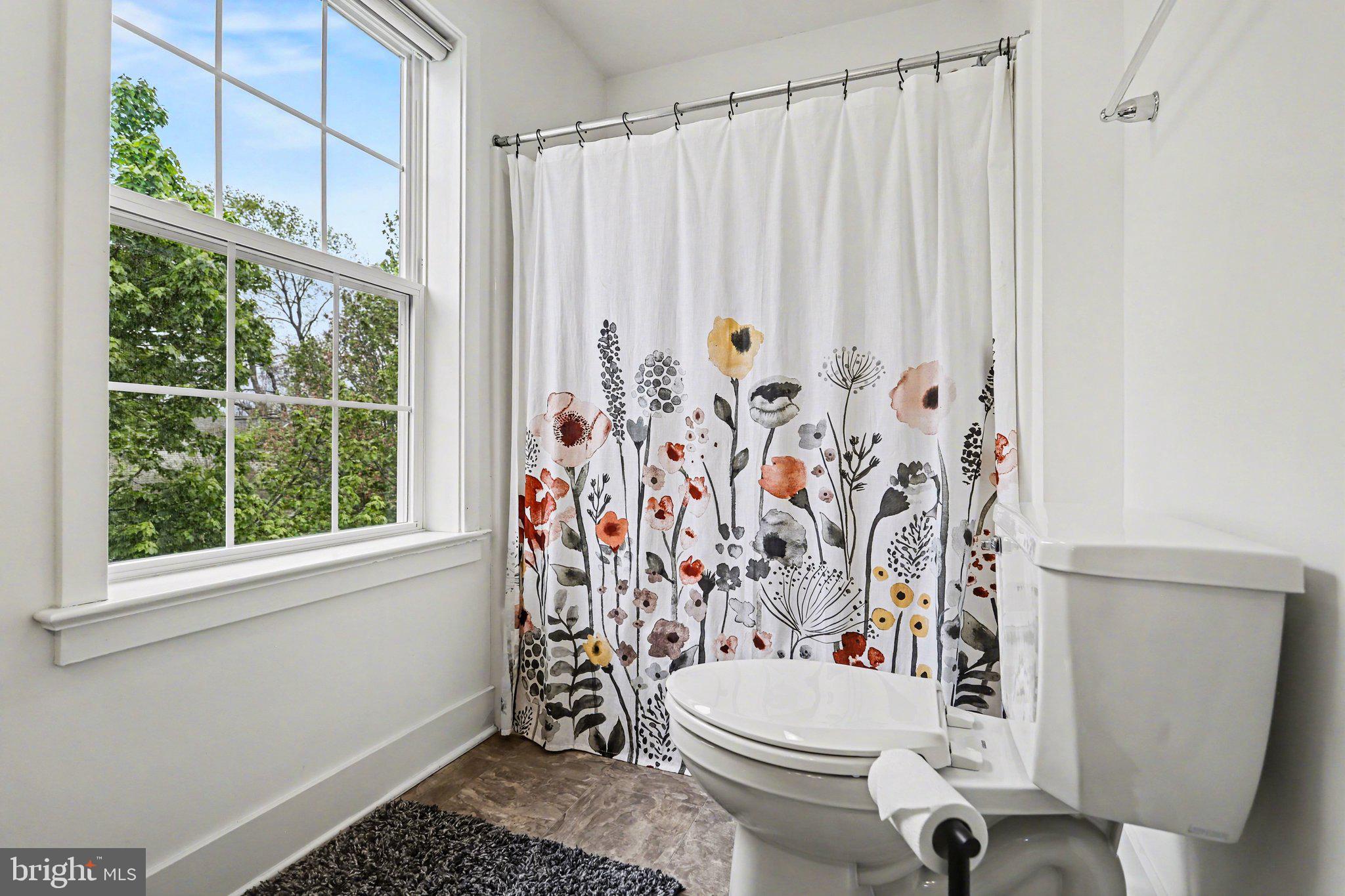 401 Wendover Way Lancaster, PA 17603 - Photo 29 of 45 a white toilet sitting next to a shower curtain