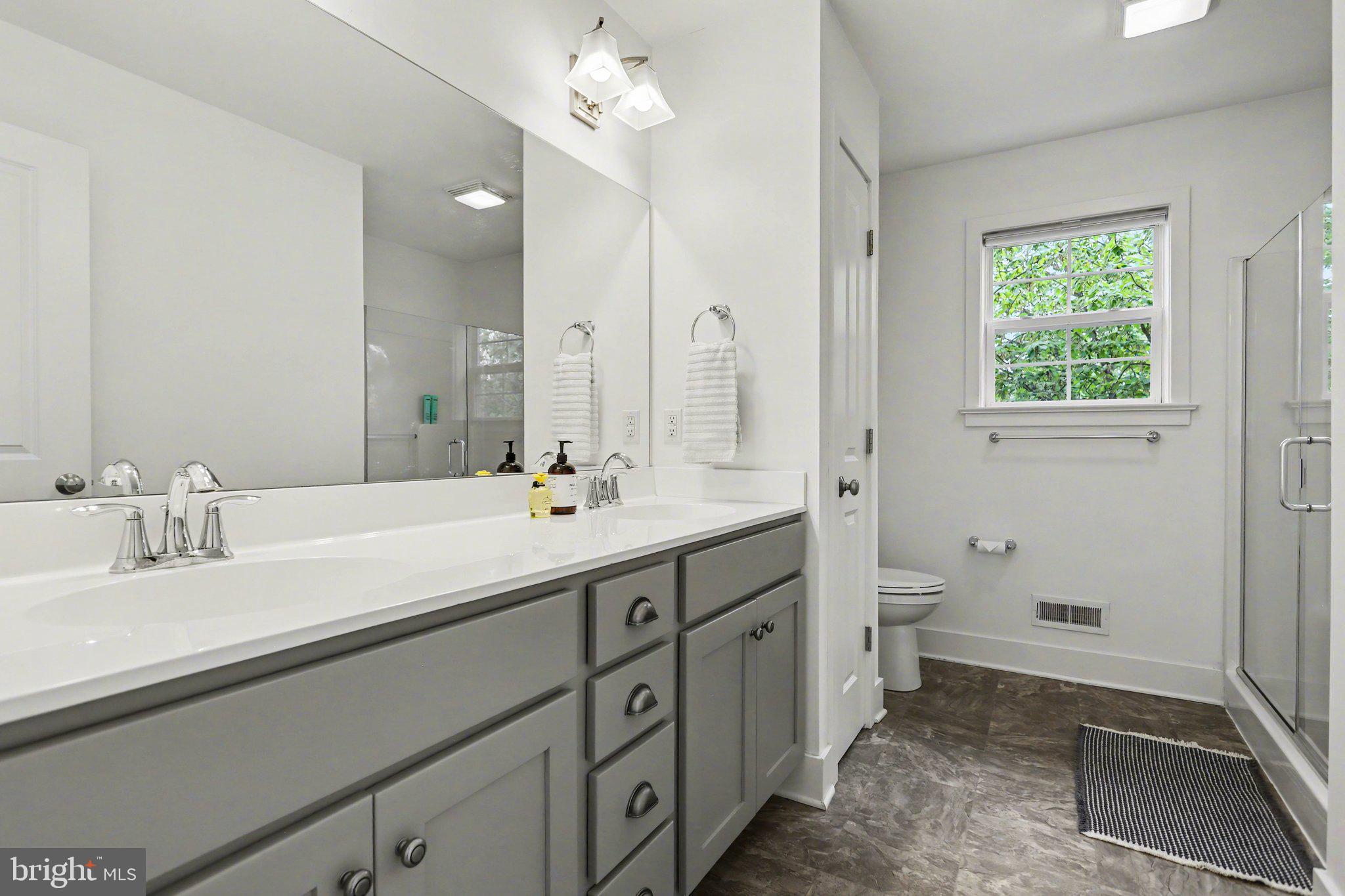 401 Wendover Way Lancaster, PA 17603 - Photo 33 of 45 a spacious bathroom with a double vanity sink a mirror and a toilet
