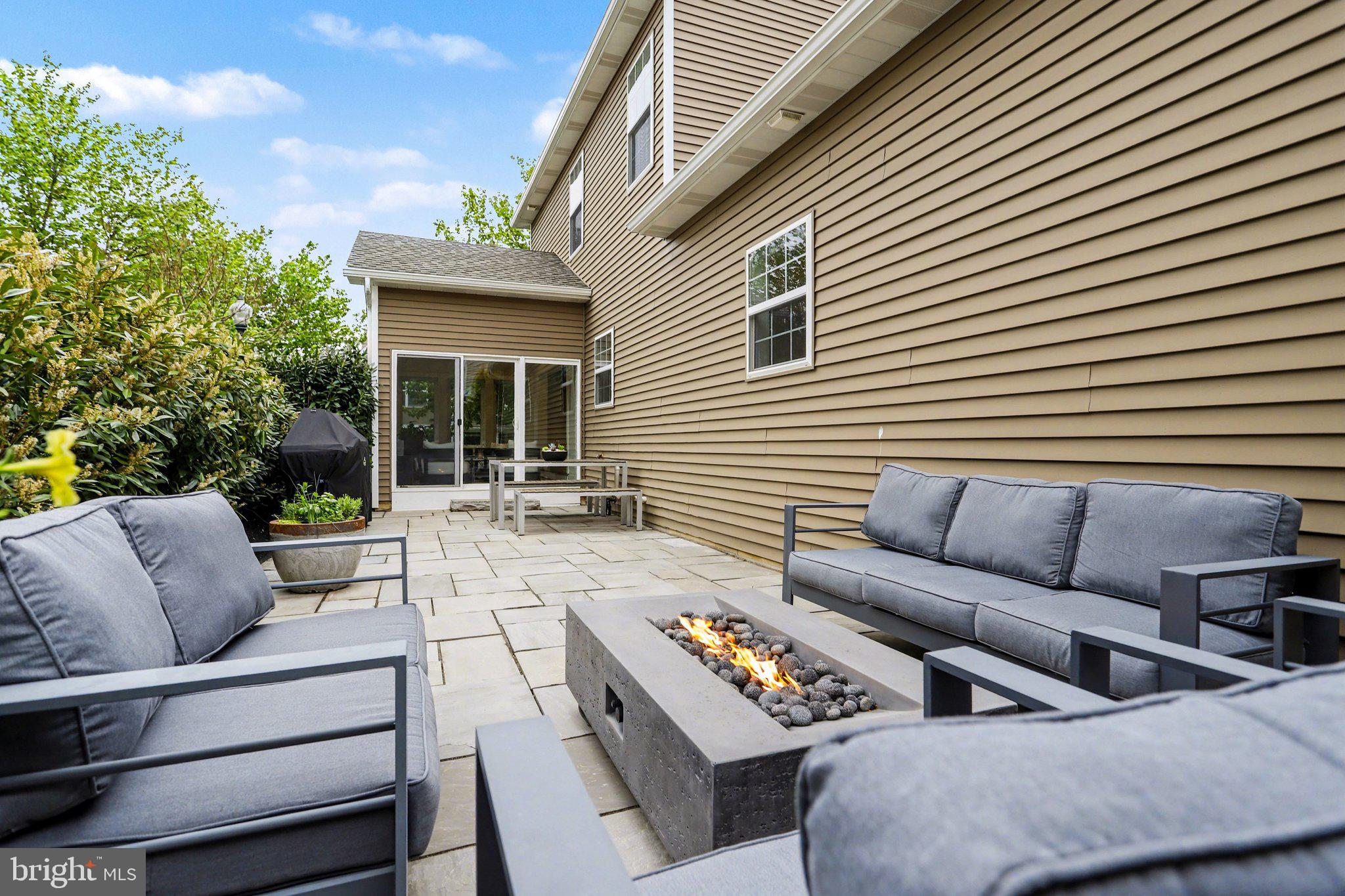 401 Wendover Way Lancaster, PA 17603 - Photo 37 of 45 a view of a patio with couches and a table and chairs with wooden floor