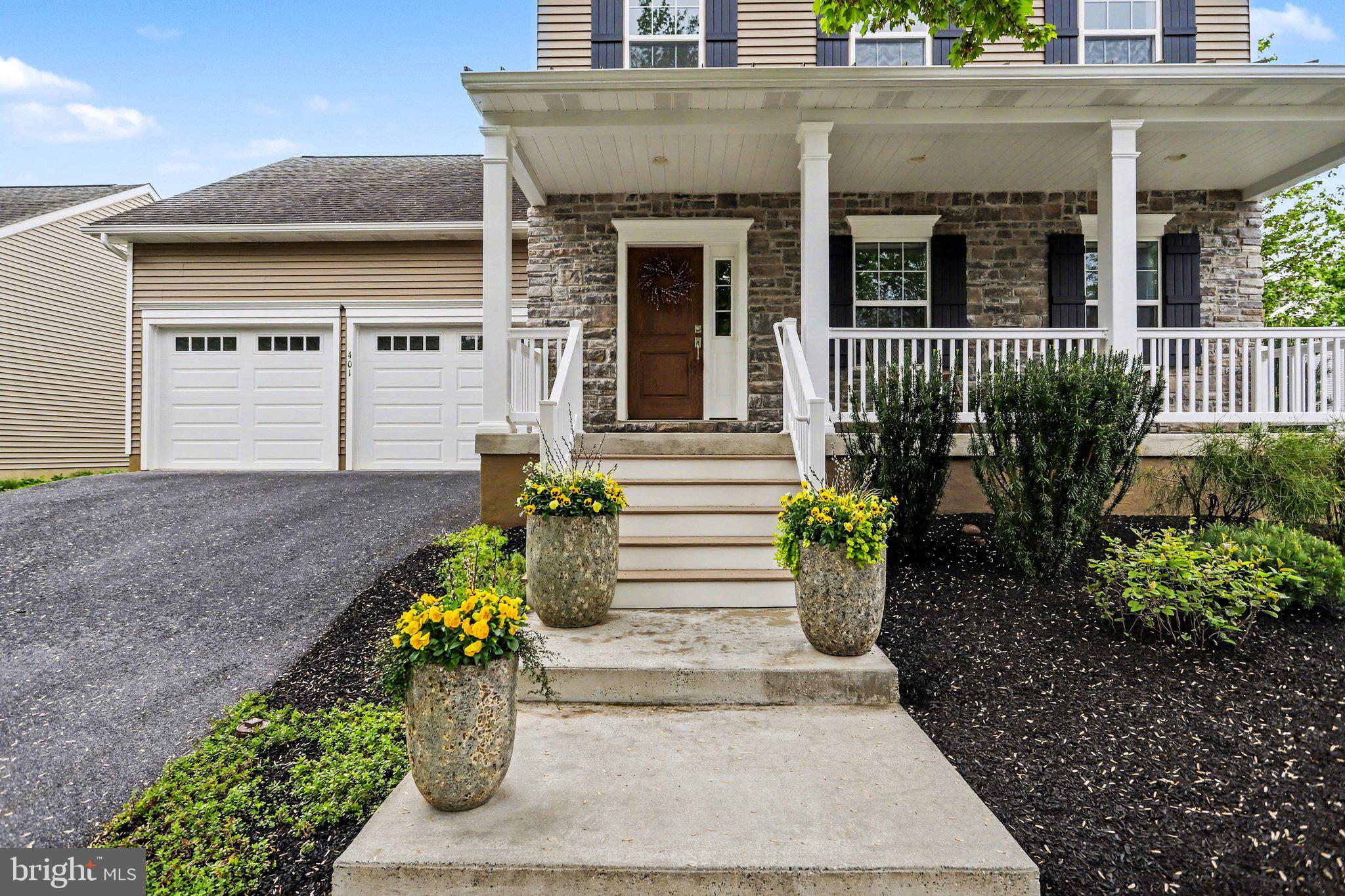401 Wendover Way Lancaster, PA 17603 - Photo 4 of 45 a front view of a house with potted plants