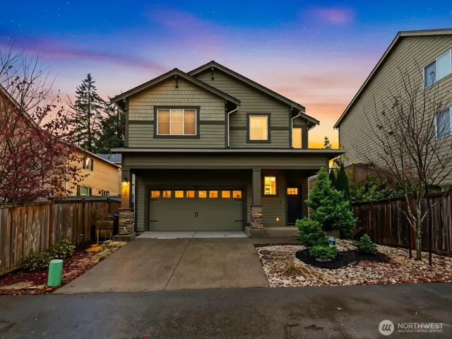 a front view of a house with garage