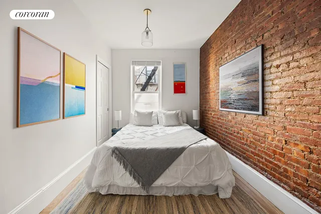 a bedroom with a bed and a couch