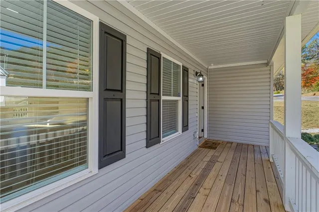 a kitchen with granite countertop white cabinets and stainless steel appliances