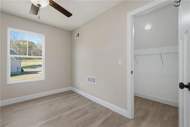 a view of an empty room with stairs