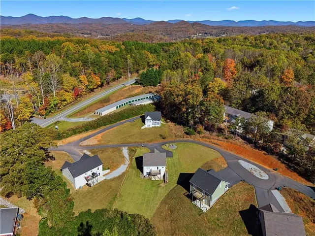 a view of a kitchen with a sink and a refrigerator