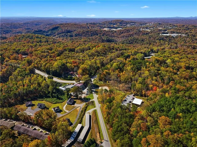 a view of a kitchen with a stove cabinets and a large window