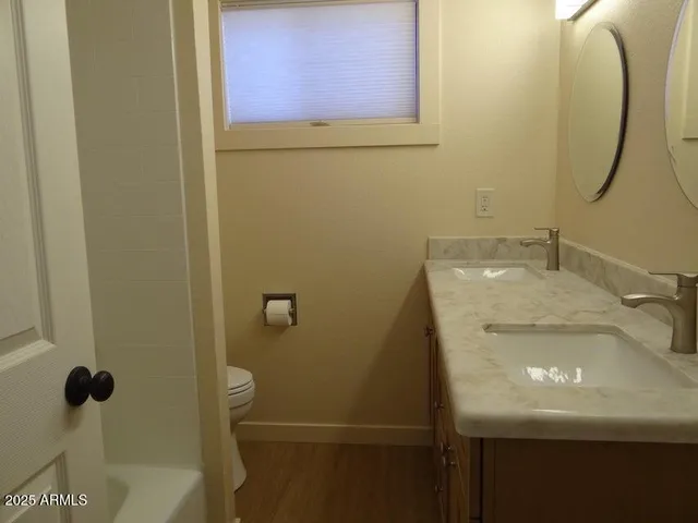 a bathroom with a sink and mirror