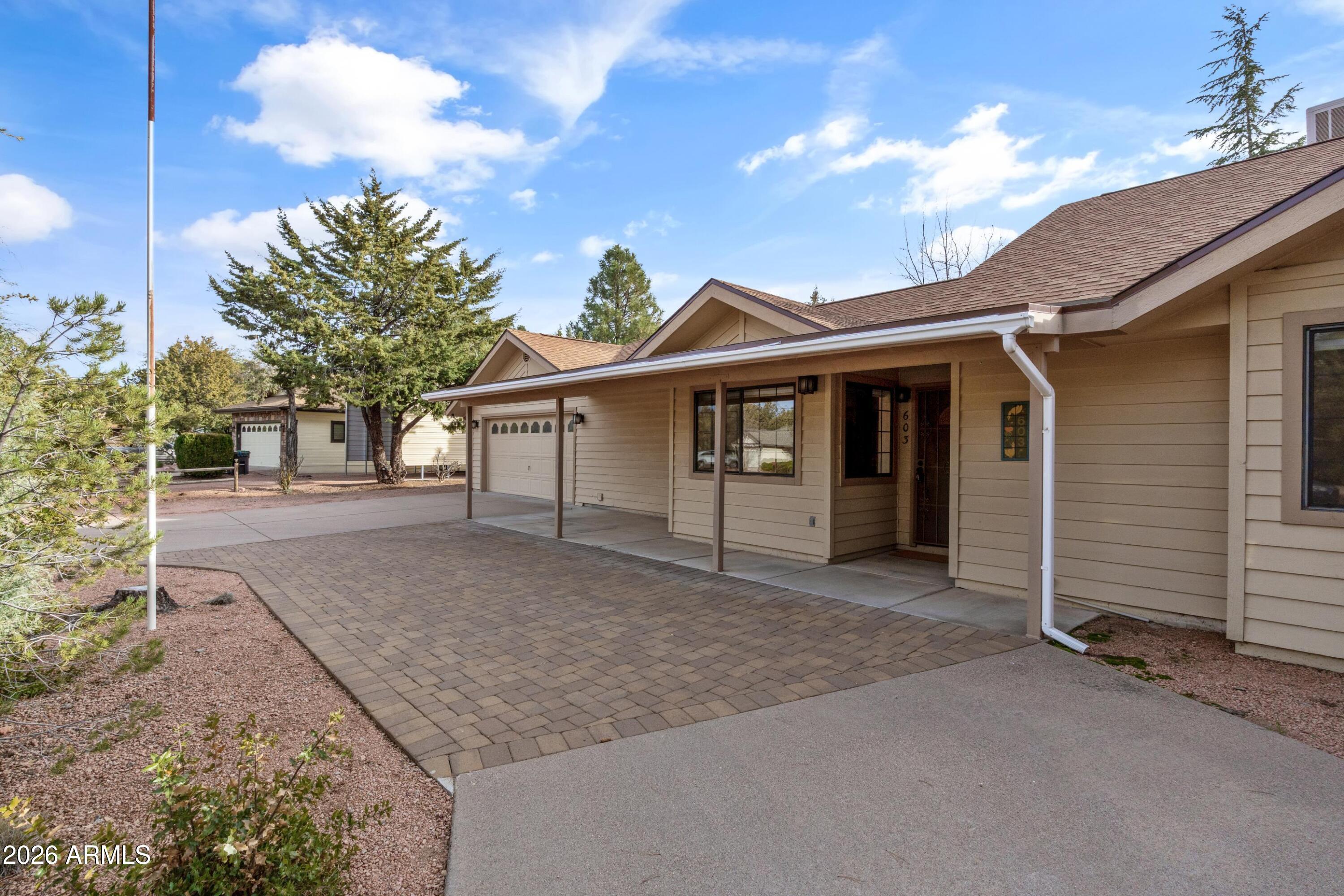 603 East Amarillo Circle Payson, AZ 85541 - Photo 15 of 54 a front view of a house with a yard and garage