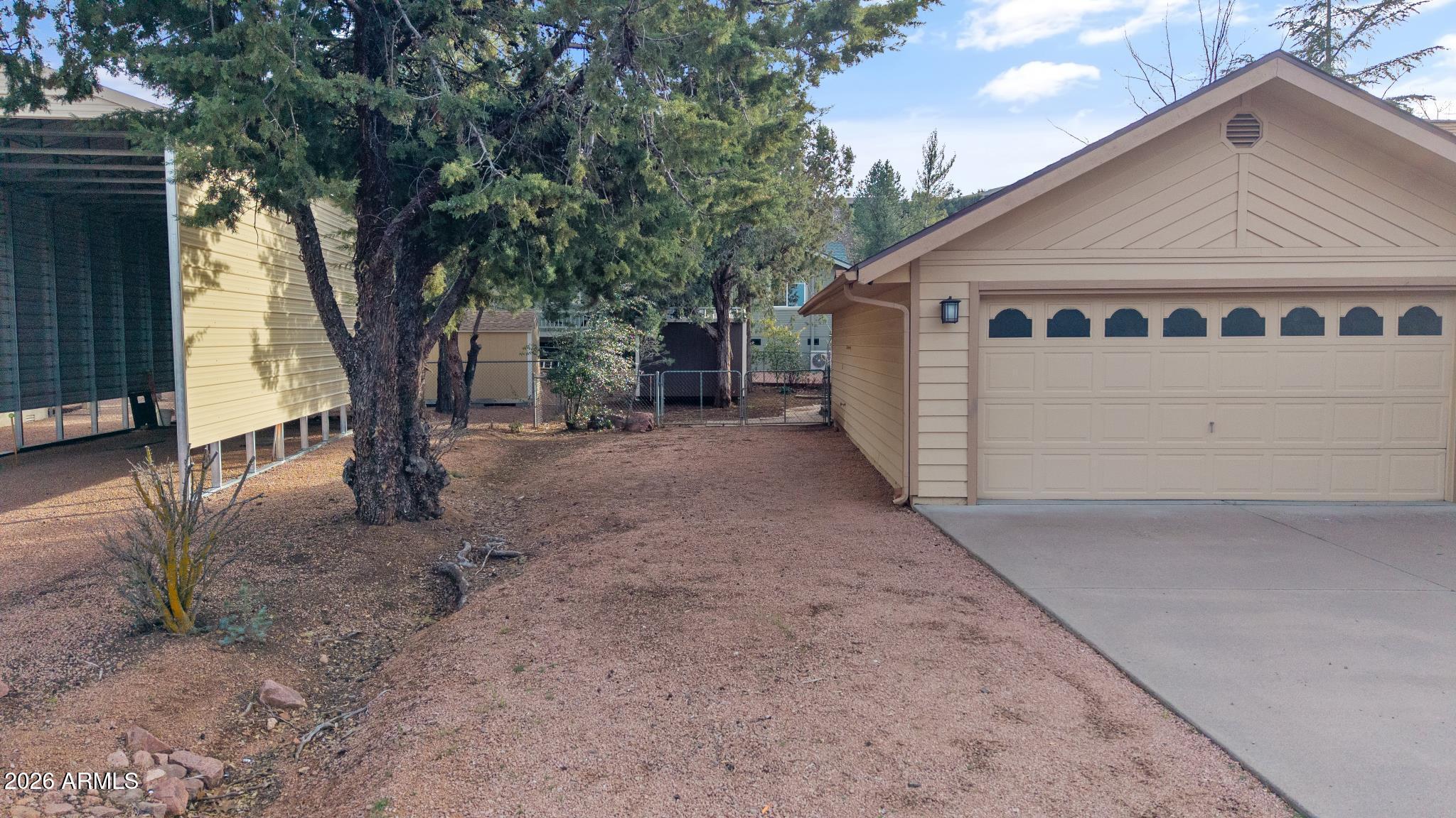 603 East Amarillo Circle Payson, AZ 85541 - Photo 16 of 54 a view of a house with a yard and garage