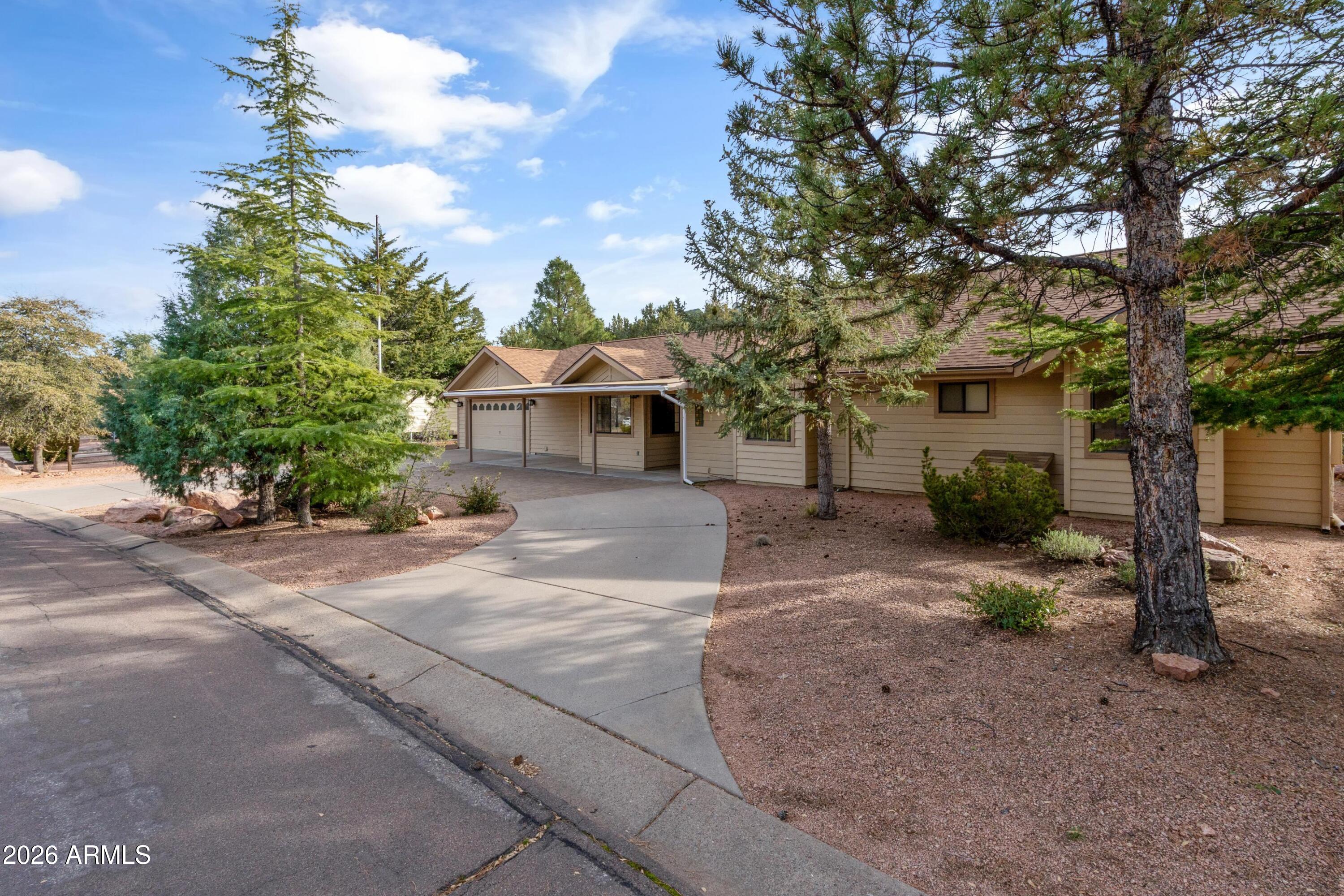 603 East Amarillo Circle Payson, AZ 85541 - Photo 18 of 54 a view of a house with a tree and a yard
