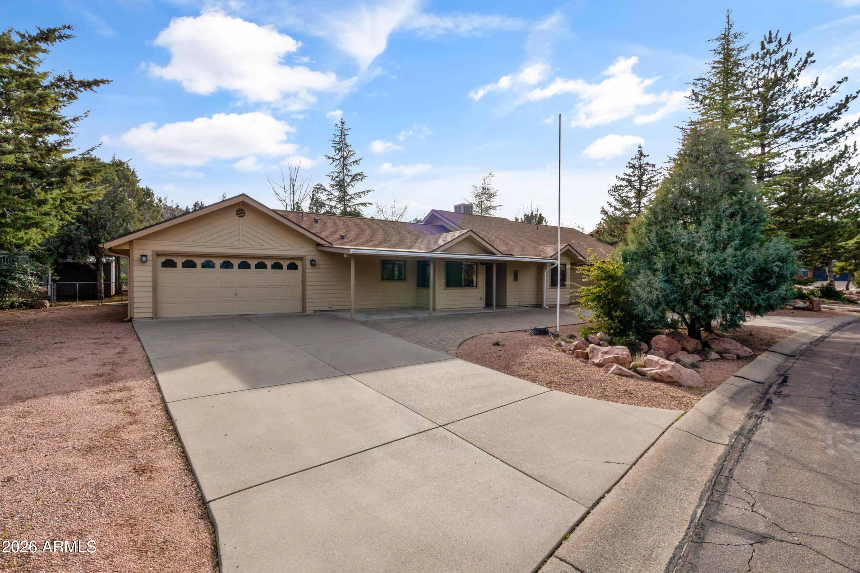 603 East Amarillo Circle Payson, AZ 85541 - Photo 19 of 54 a front view of a house with a garden