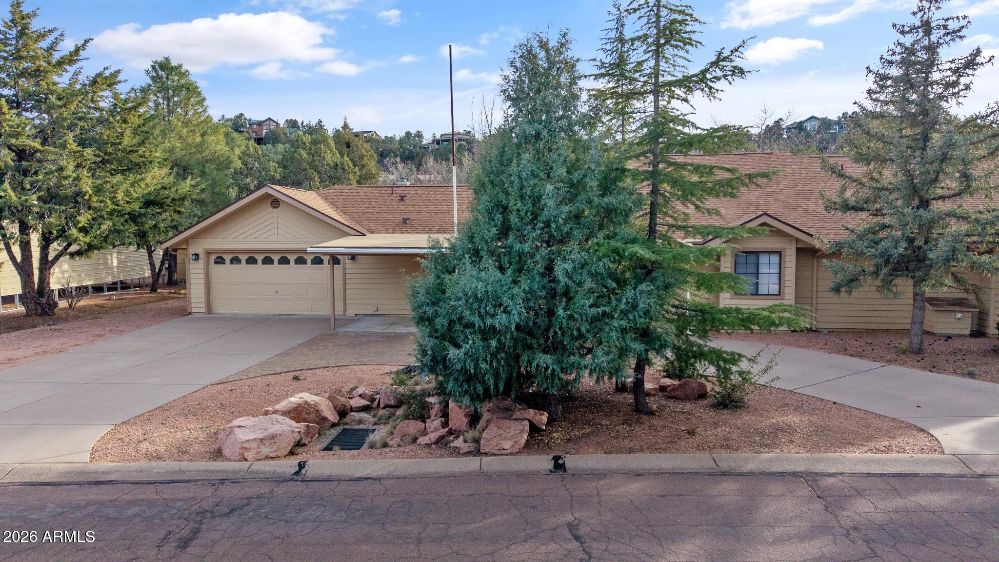 603 East Amarillo Circle Payson, AZ 85541 - Photo 2 of 54 a view of a house with a garden and pathway