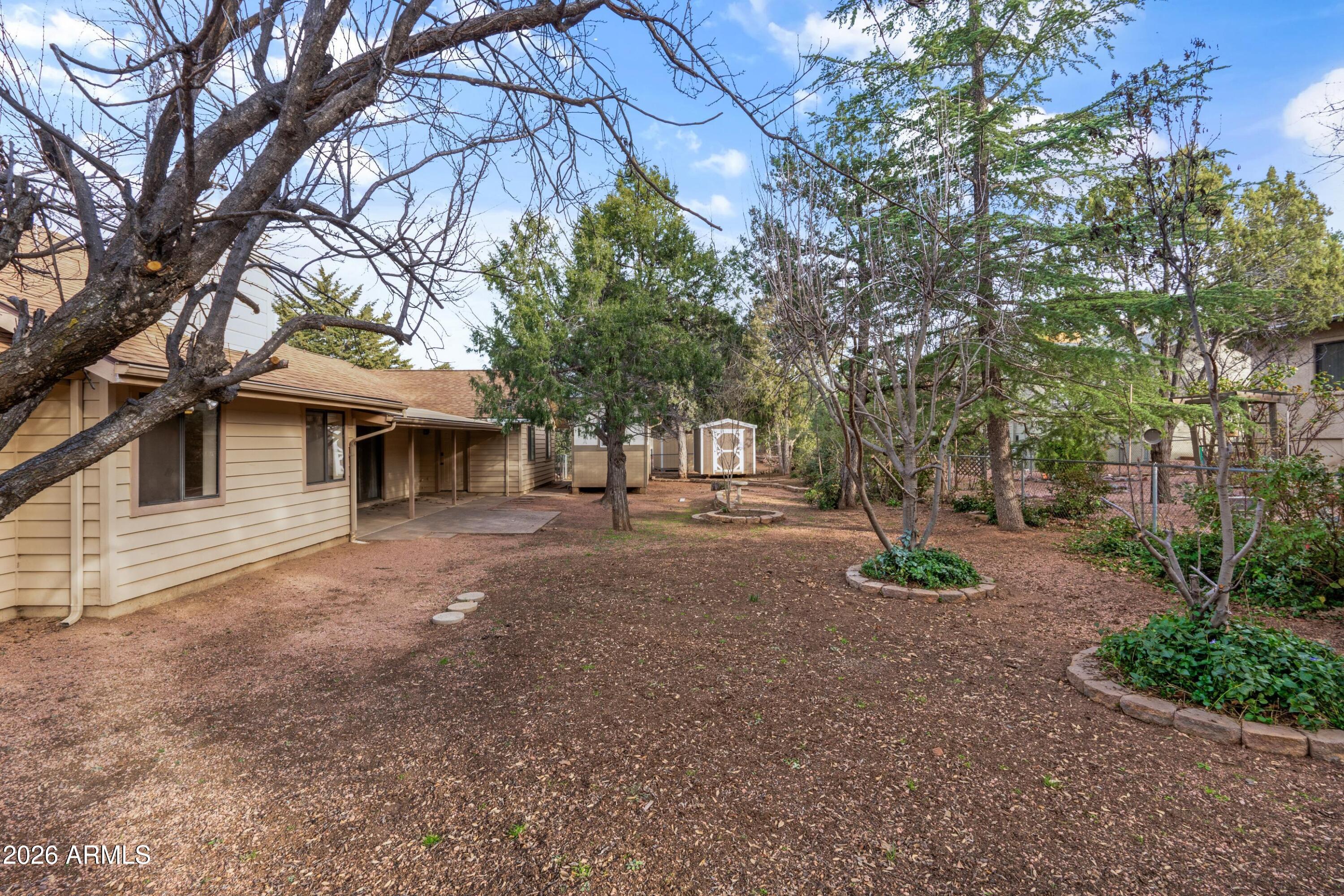 603 East Amarillo Circle Payson, AZ 85541 - Photo 27 of 54 a front view of a house with a garden