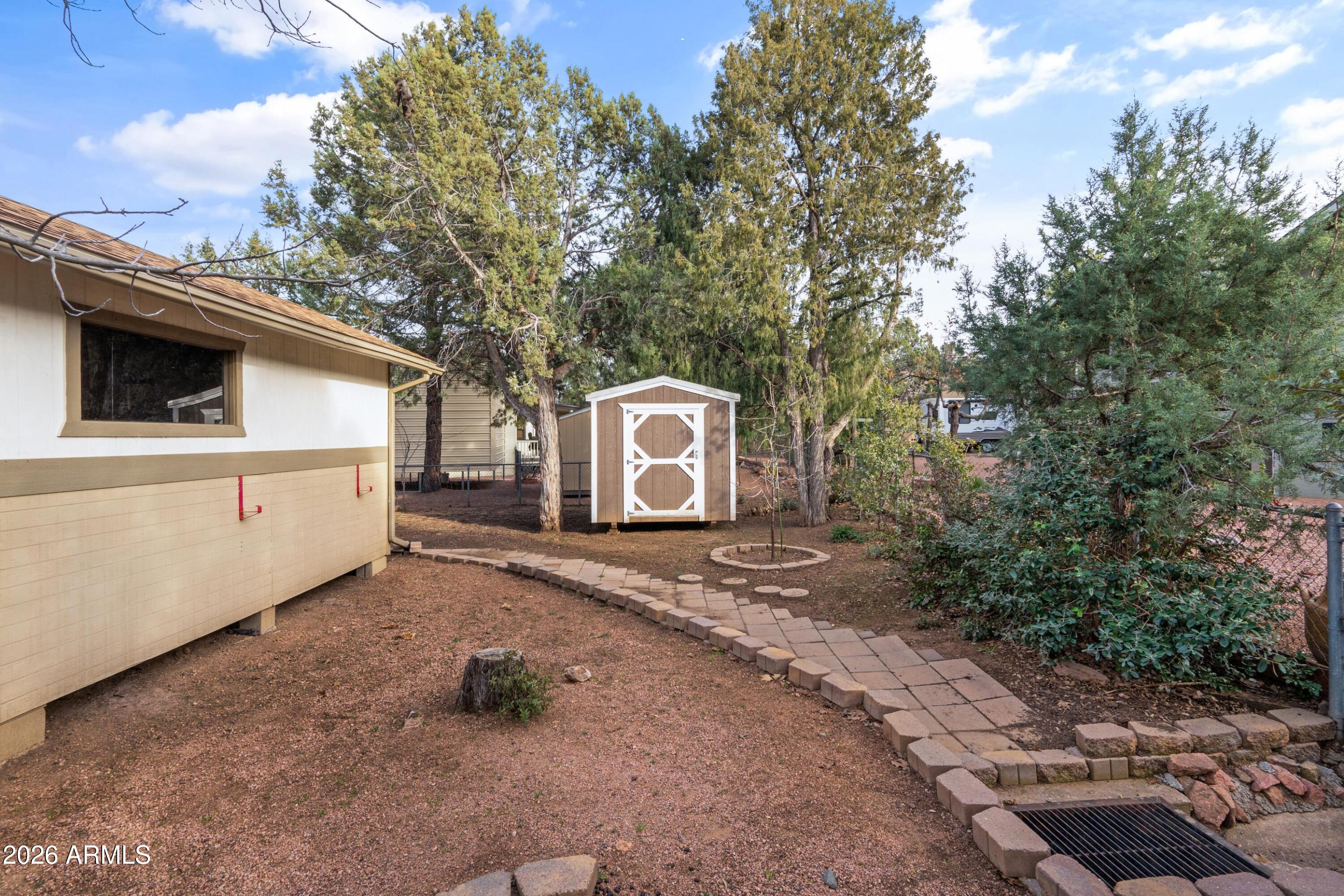 603 East Amarillo Circle Payson, AZ 85541 - Photo 28 of 54 a house with trees in the background