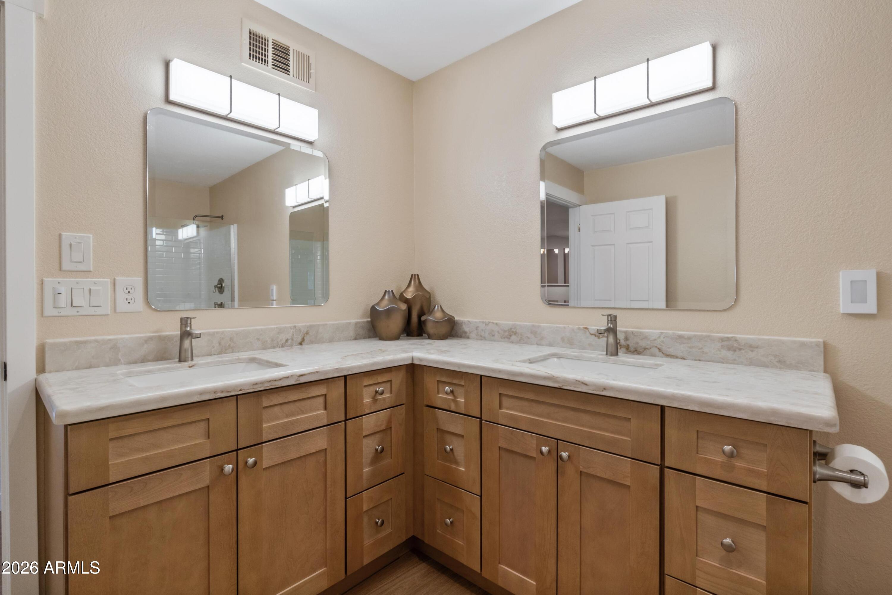 603 East Amarillo Circle Payson, AZ 85541 - Photo 37 of 54 a bathroom with a double vanity sink and mirror