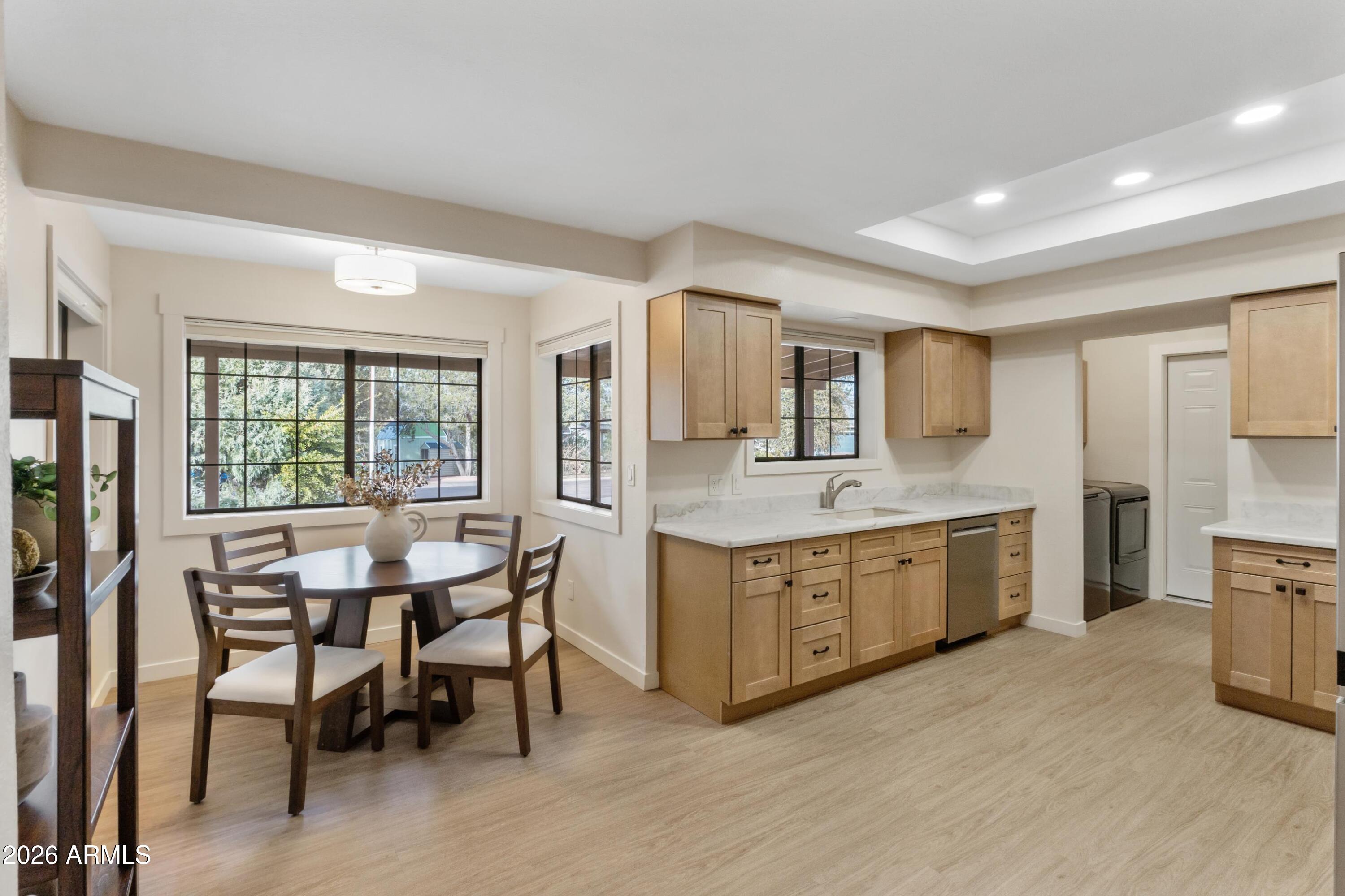 603 East Amarillo Circle Payson, AZ 85541 - Photo 4 of 54 a kitchen with granite countertop a sink and chairs