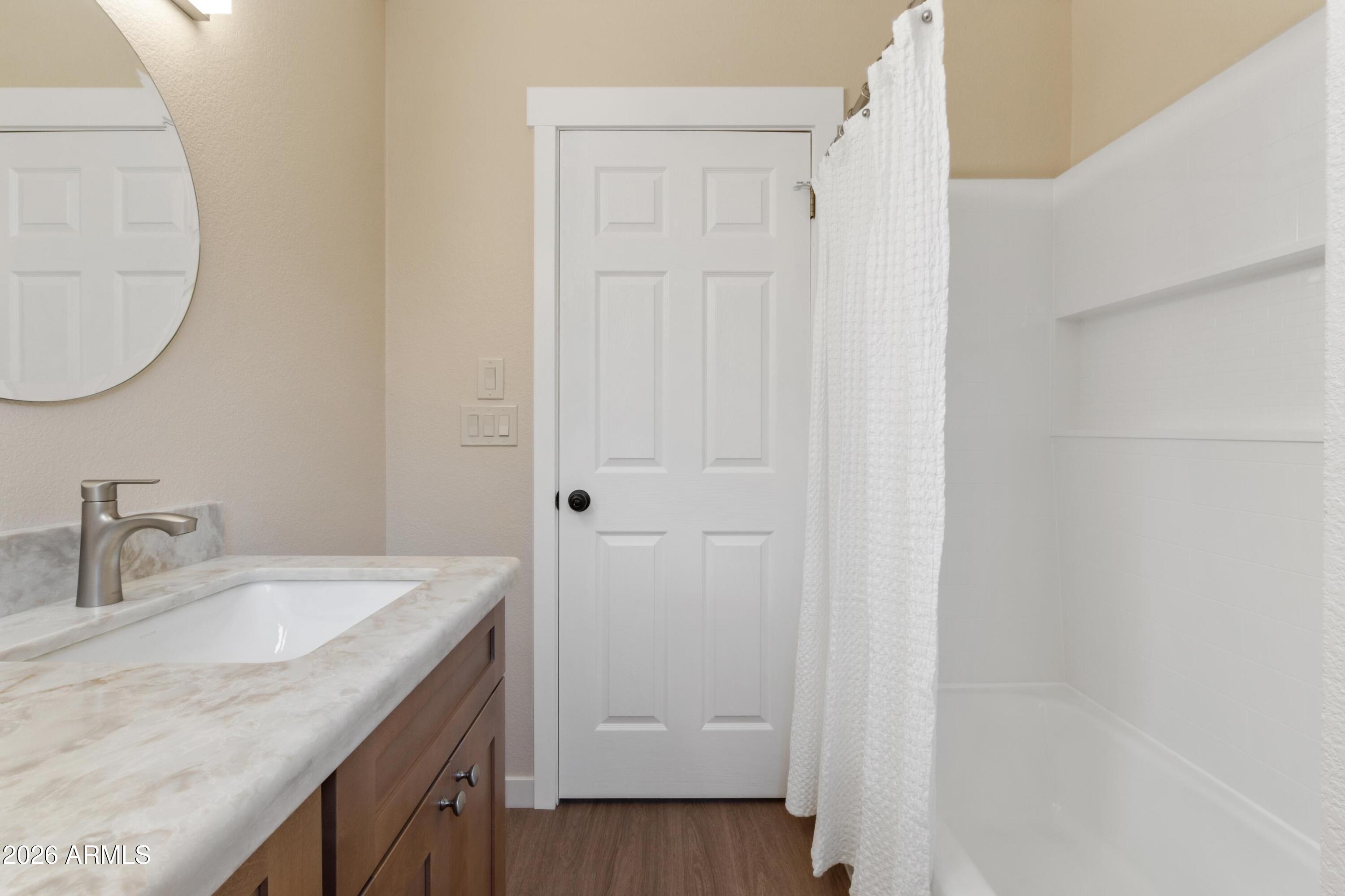 603 East Amarillo Circle Payson, AZ 85541 - Photo 41 of 54 a bathroom with a granite countertop sink and a mirror