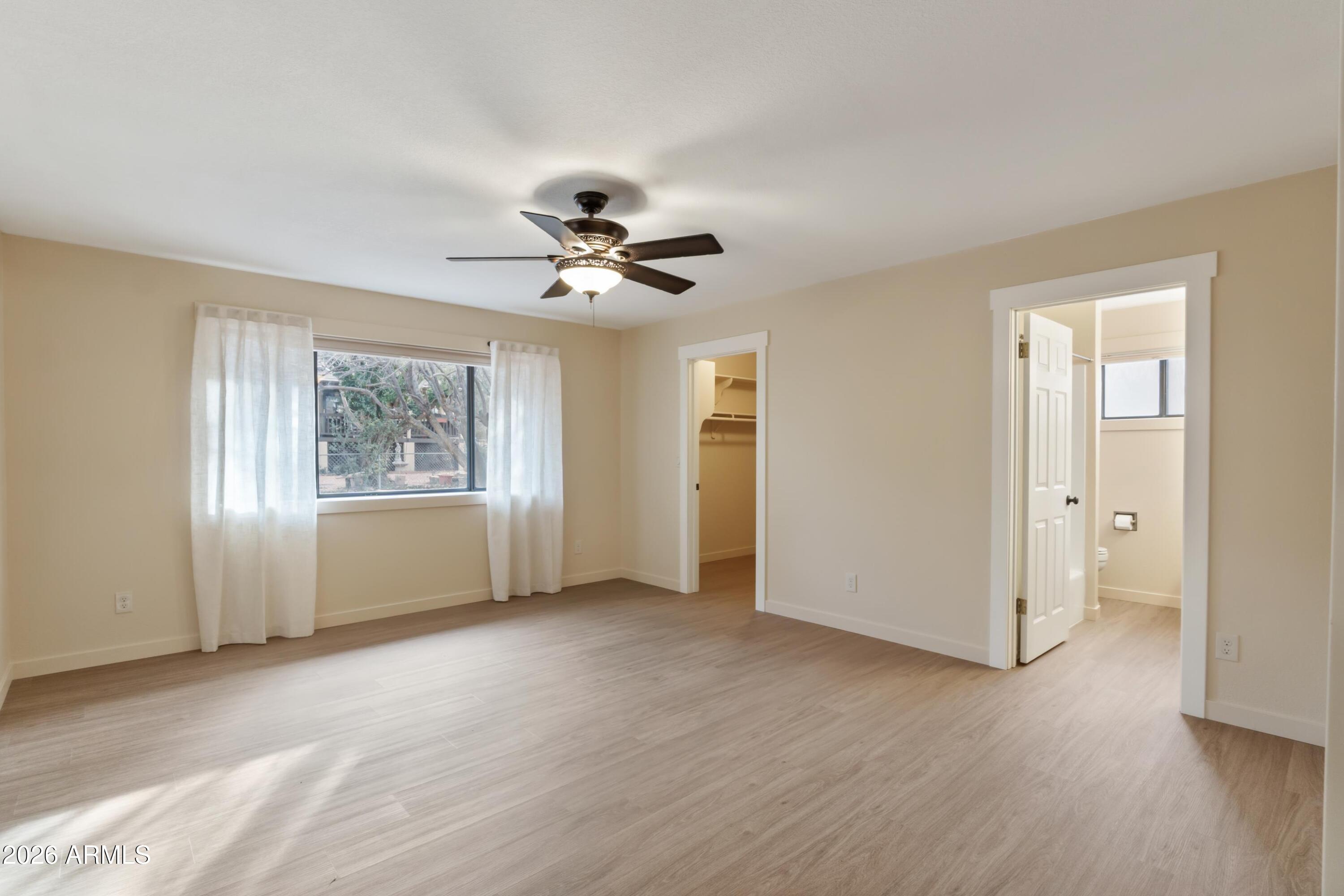 603 East Amarillo Circle Payson, AZ 85541 - Photo 43 of 54 a view of an empty room with a window and wooden floor
