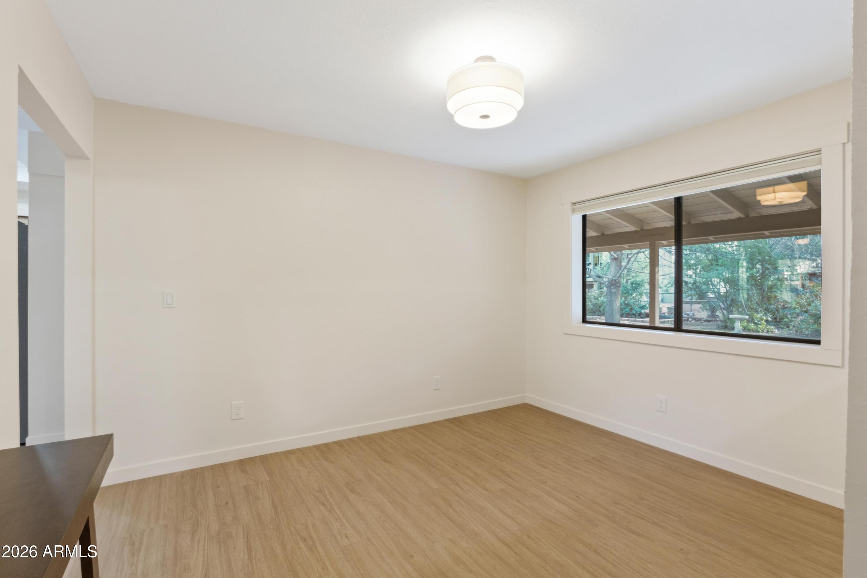 603 East Amarillo Circle Payson, AZ 85541 - Photo 8 of 54 an empty room with wooden floor and windows