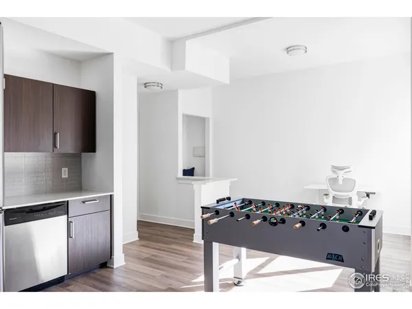 a kitchen with a refrigerator and a stove