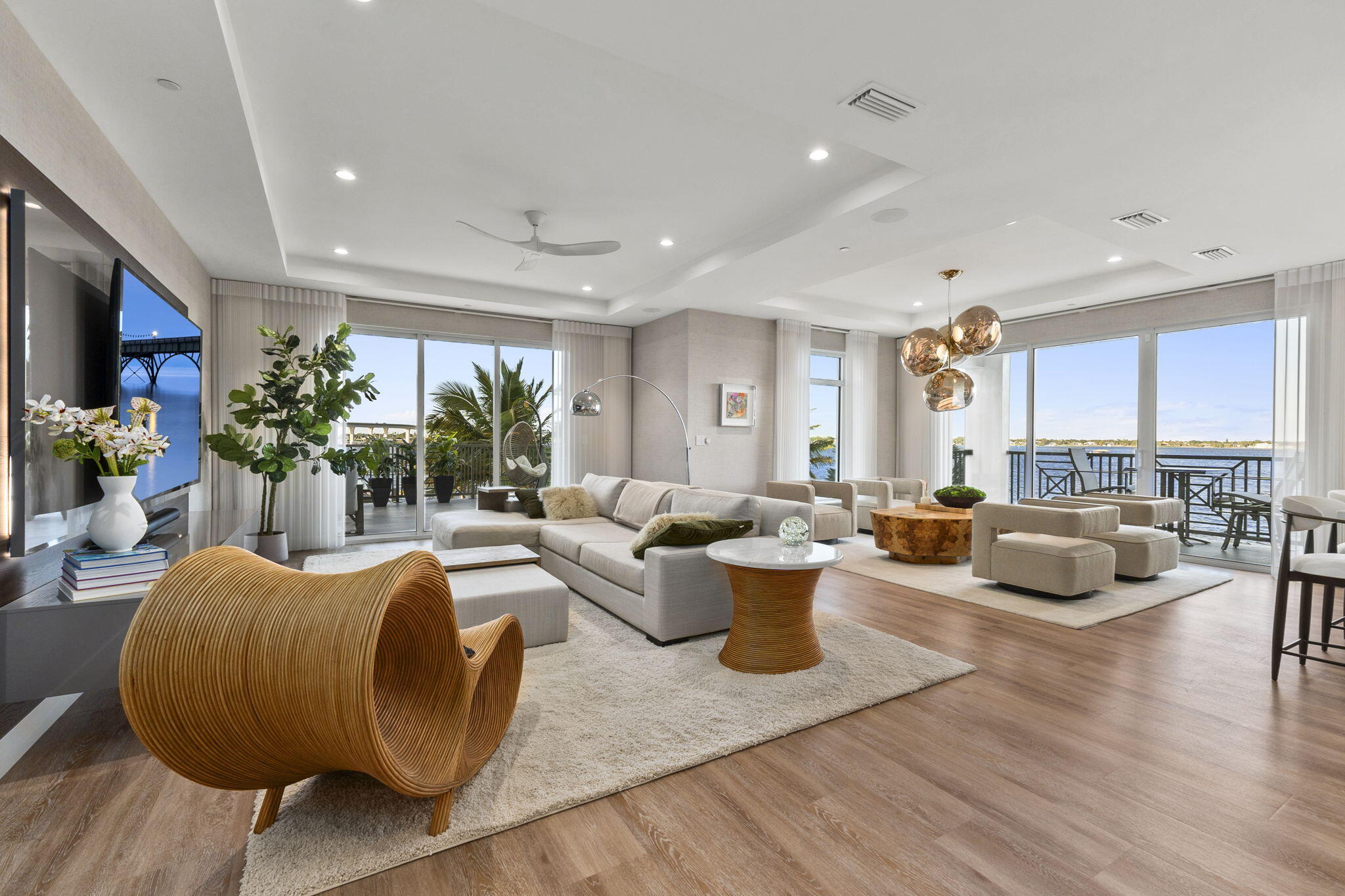 41 Southwest Seminole Street, Unit 206 Stuart, FL 34994 - Photo 12 of 72 a living room with furniture a rug kitchen view and a potted plant
