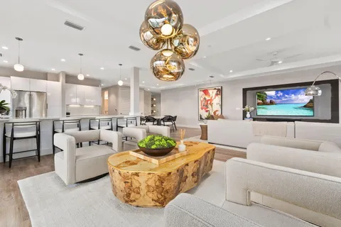 a kitchen with kitchen island and stainless steel appliances