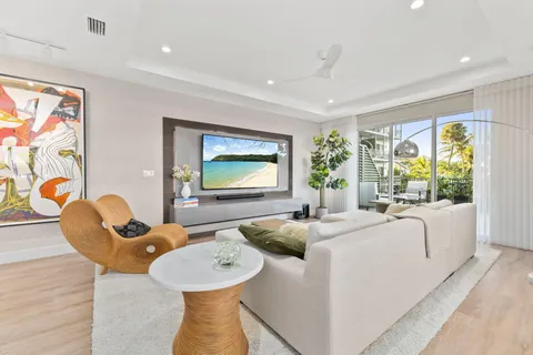 a large kitchen with stainless steel appliances kitchen island granite countertop a large counter top and a sink