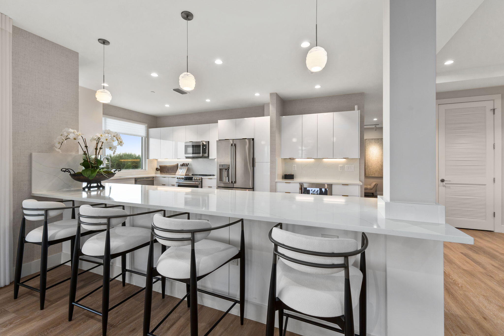 41 Southwest Seminole Street, Unit 206 Stuart, FL 34994 - Photo 22 of 72 a kitchen with kitchen island and stainless steel appliances