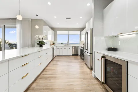 a view of a chairs and table in a balcony