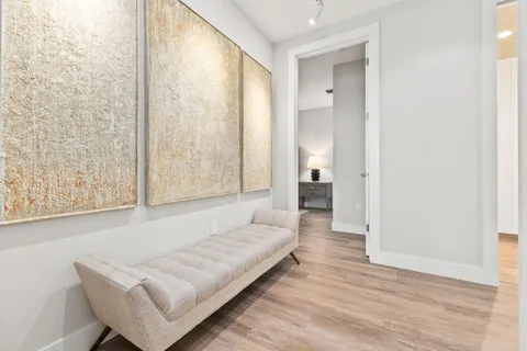 a bathroom with a shower and a glass door